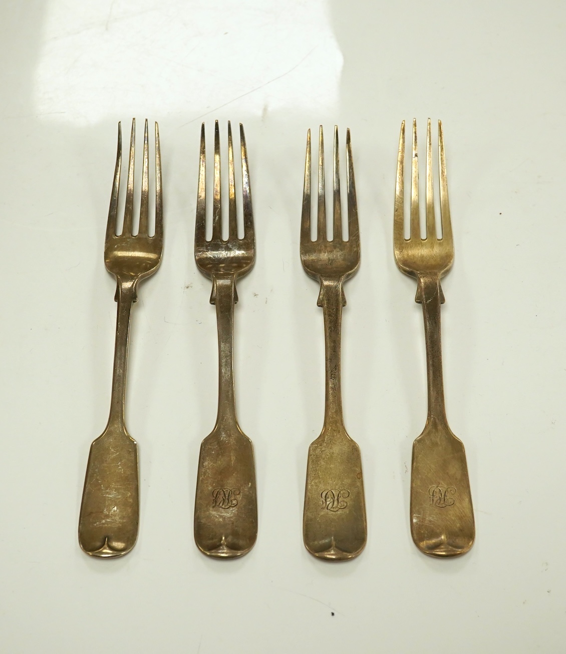 A Victorian harlequin part canteen of silver fiddle pattern flatware, various date and makers, 46.1oz. Condition - poor